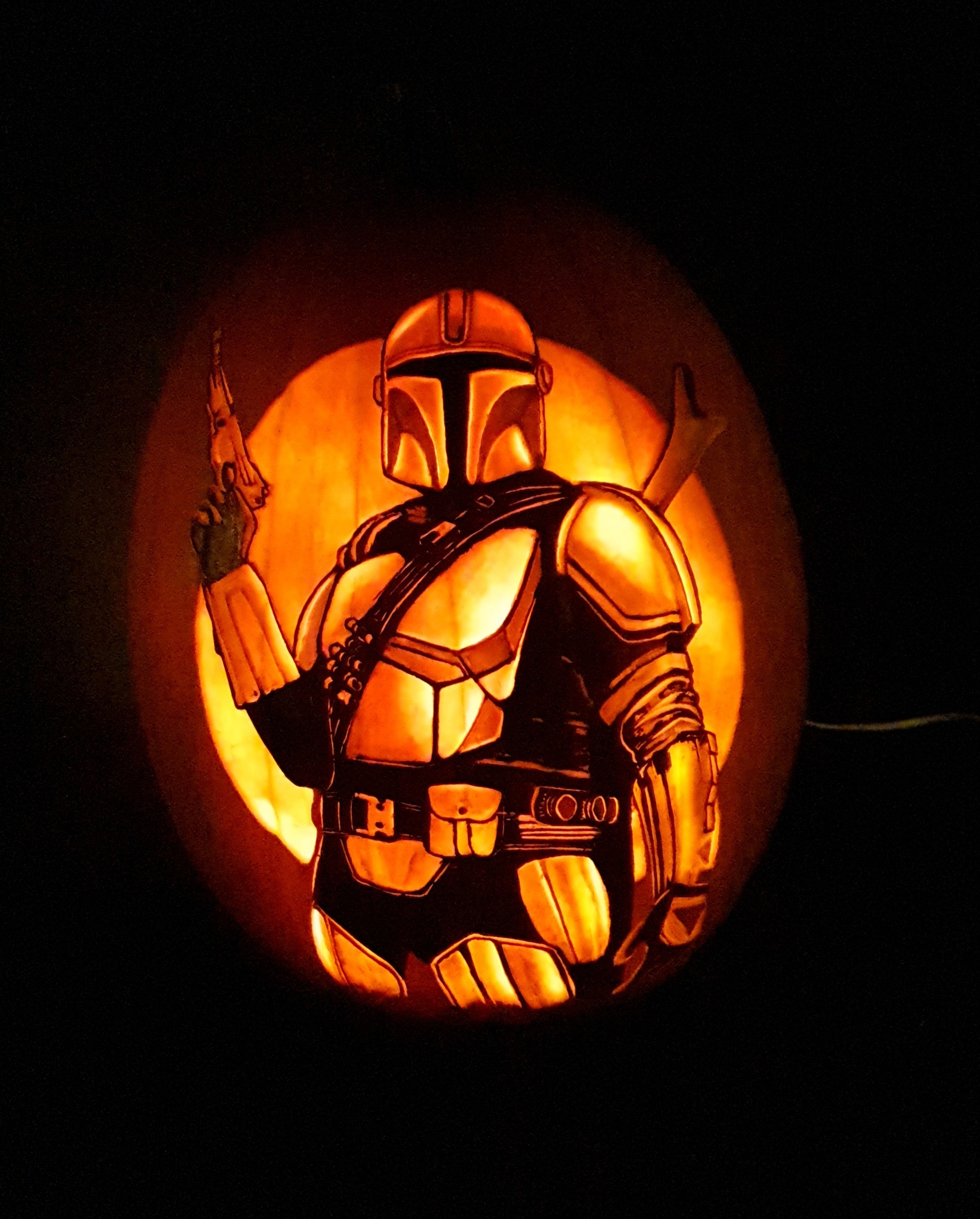 The Mandalorian carved on a pumpkin