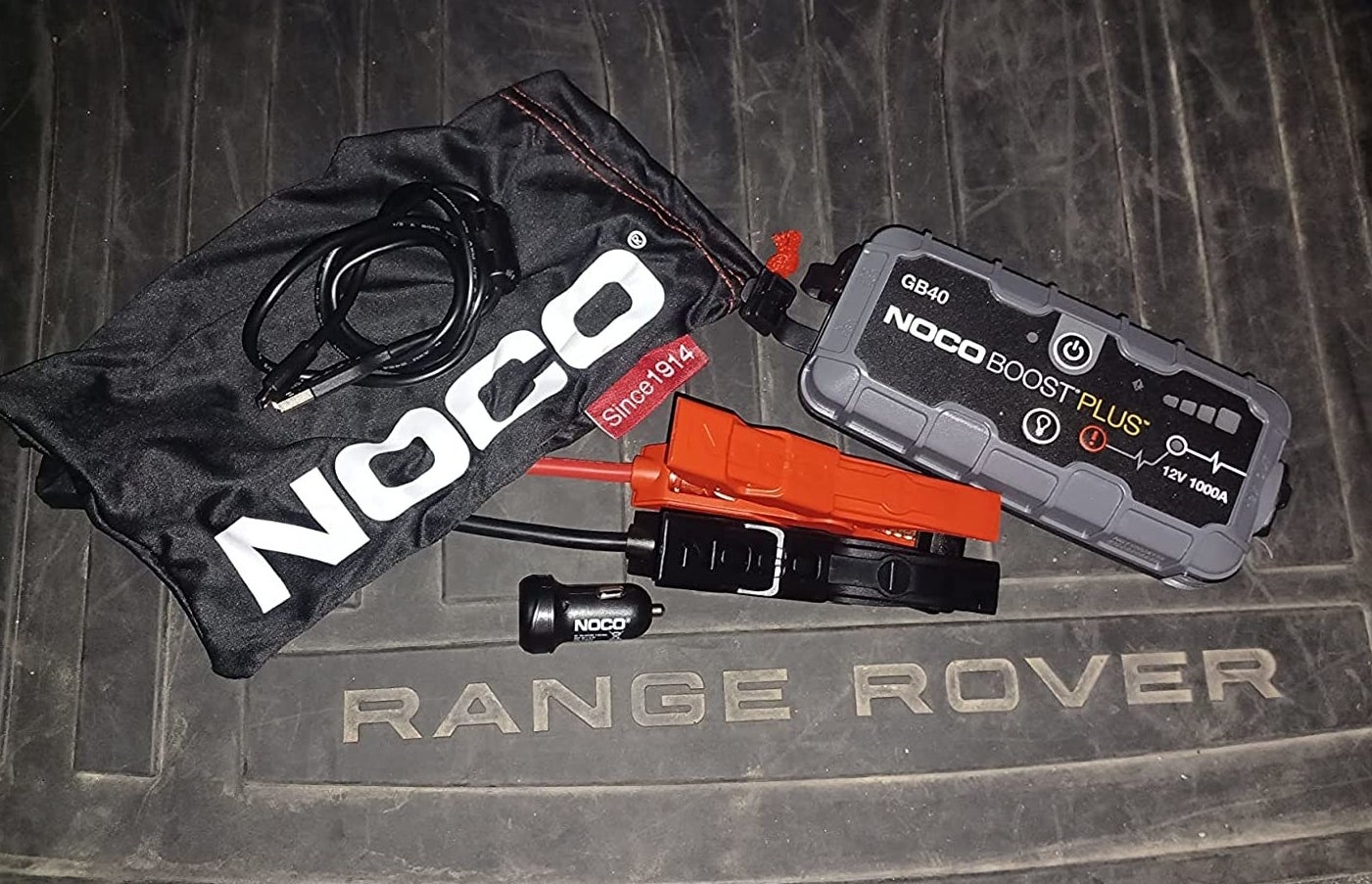a reviewer photo of the power block, jumper cables, and carrying case