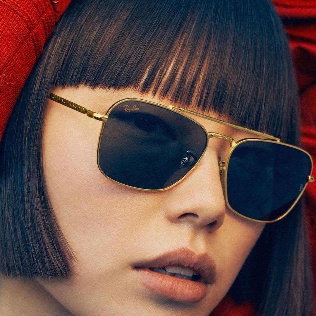 a person wearing a pair of rayban sunglasses