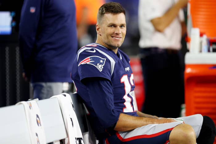 Tom sitting on the sidelines during a game