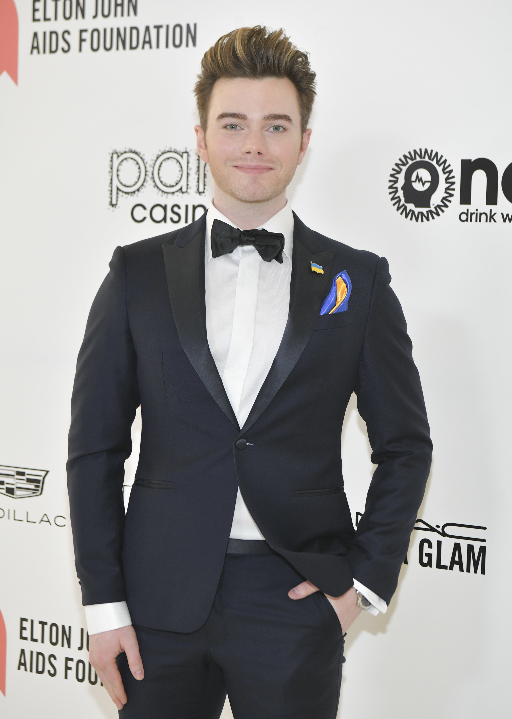 Chris in a tuxedo at a red carpet event