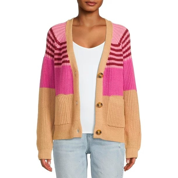 Person wearing striped cardigan with white tee and jeans