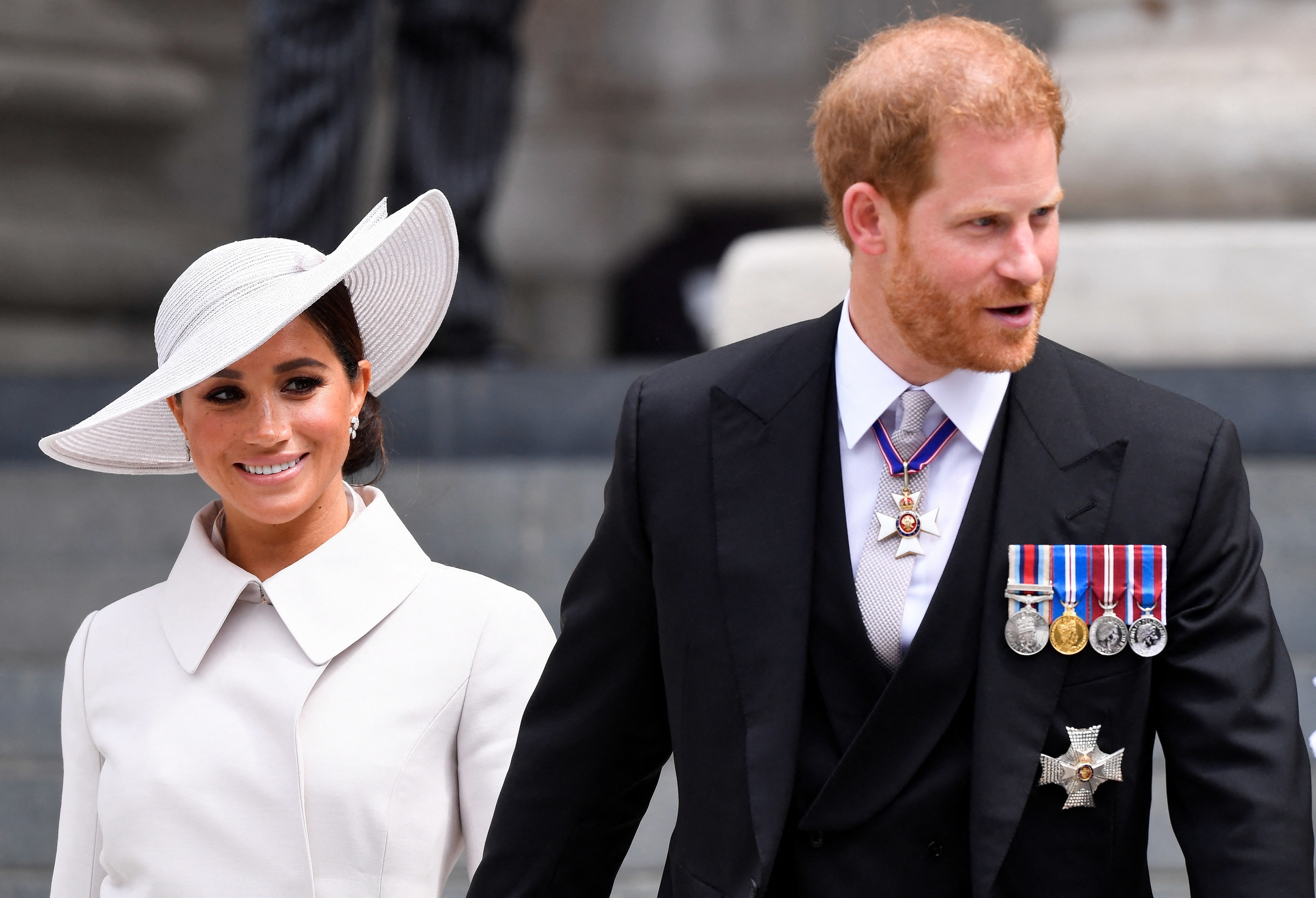 Megan and Harry walking outside