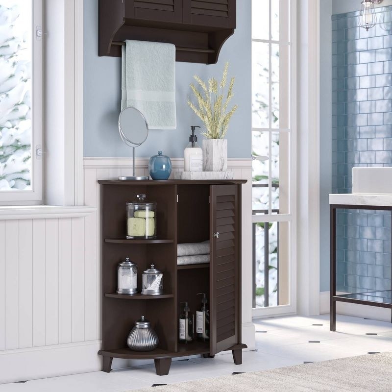 brown floor cabinet with shuttered cabinet door ajar and three side shelves