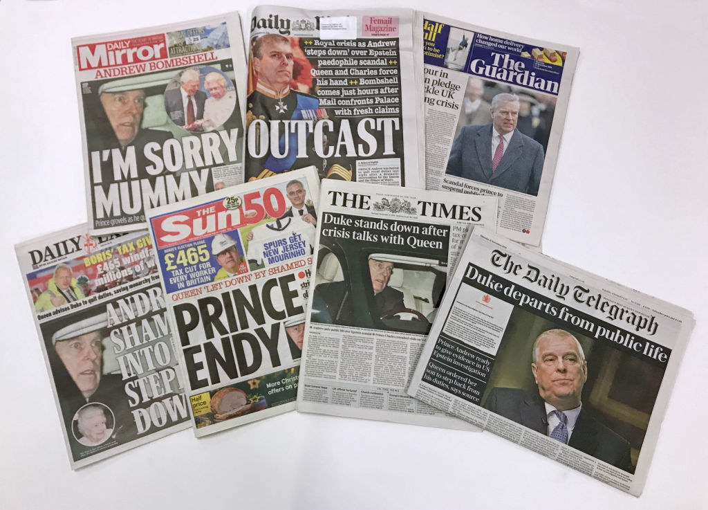 multiple newspapers with andrew as the front page story