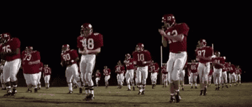 american football players dancing on a field
