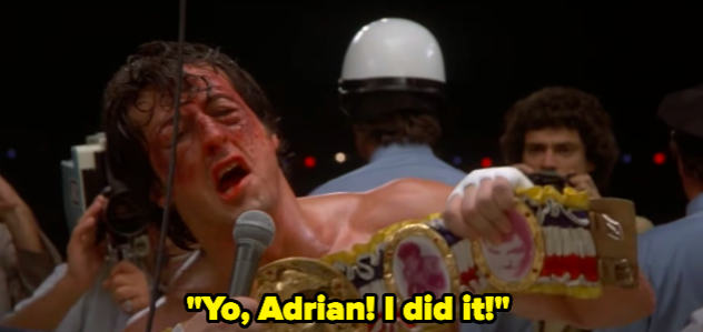 A man holds up a boxing belt and yells &quot;Yo Adrian! I did it!&quot;
