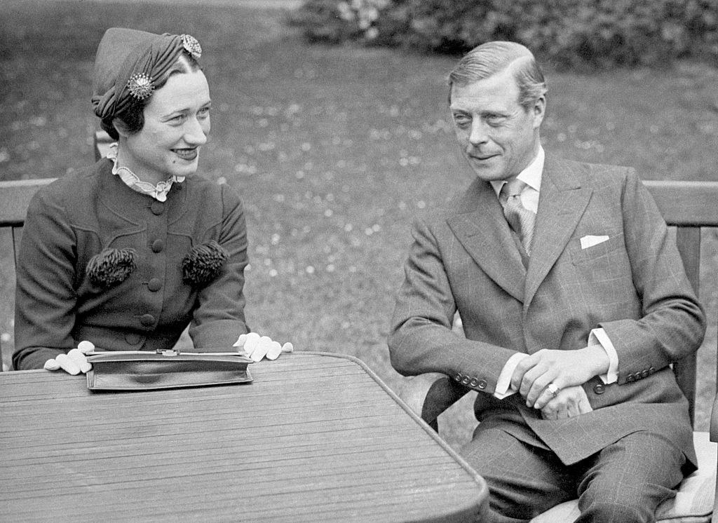 Edward and Wallis outside sitting on separate benches