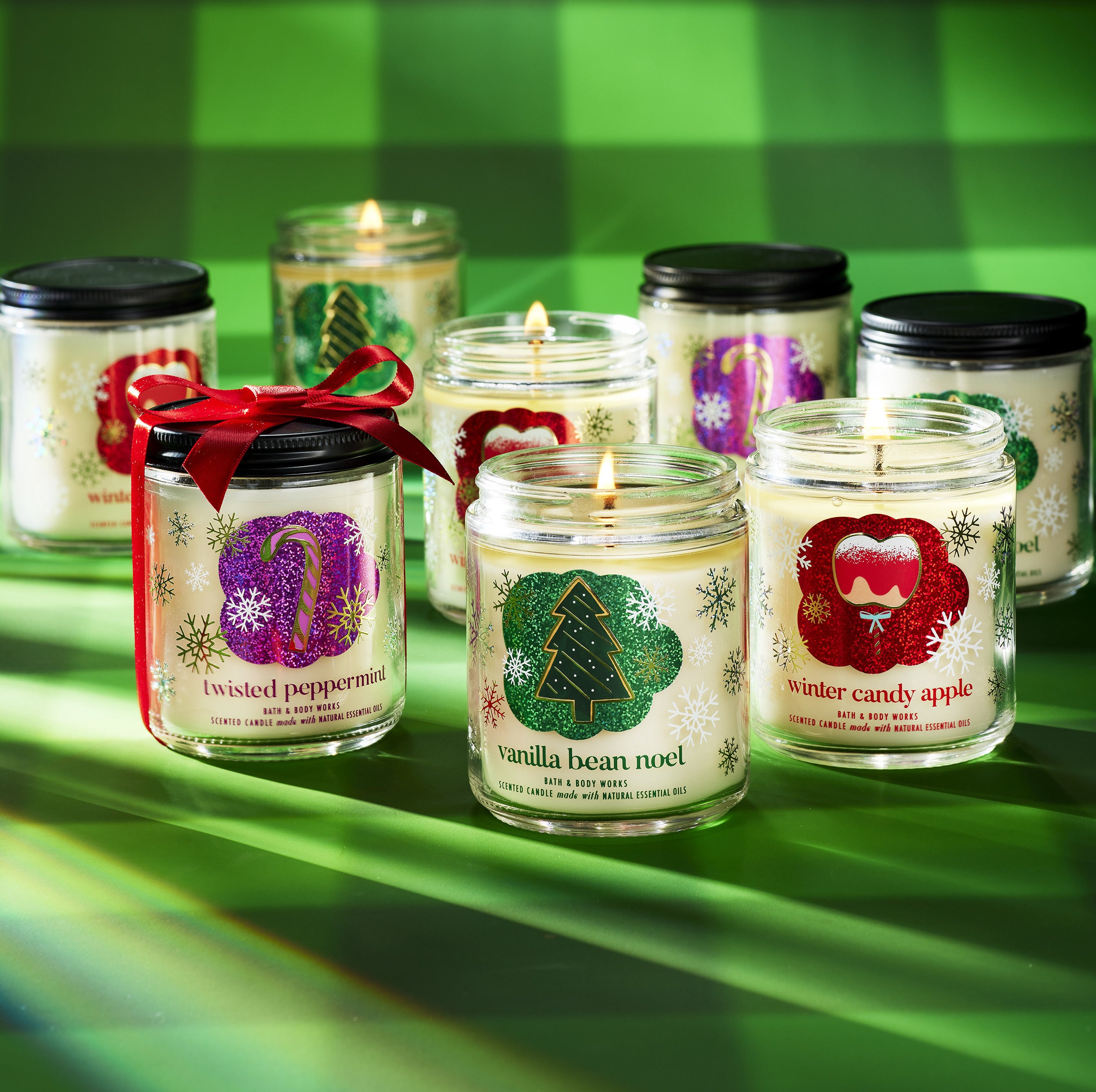 a bunch of holiday themed single-wick candles