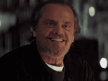 Jack Nicholson nodding and smiling wildly