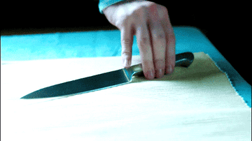 Vera Farmiga stabs with a knife