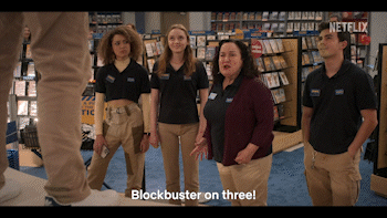 Characters holding each other&#x27;s arms saying &quot;Blockbuster on three&quot;