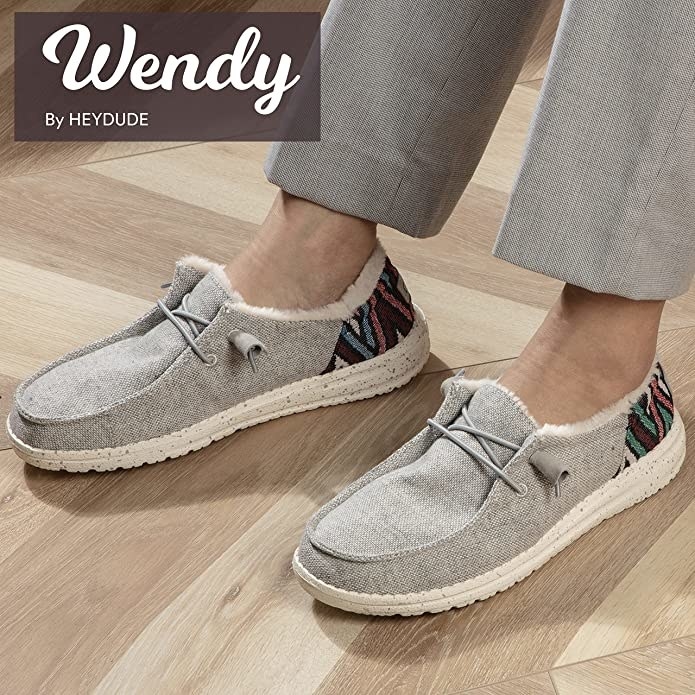 Model wearing the faux lined Wendy by Hey Dude shoes