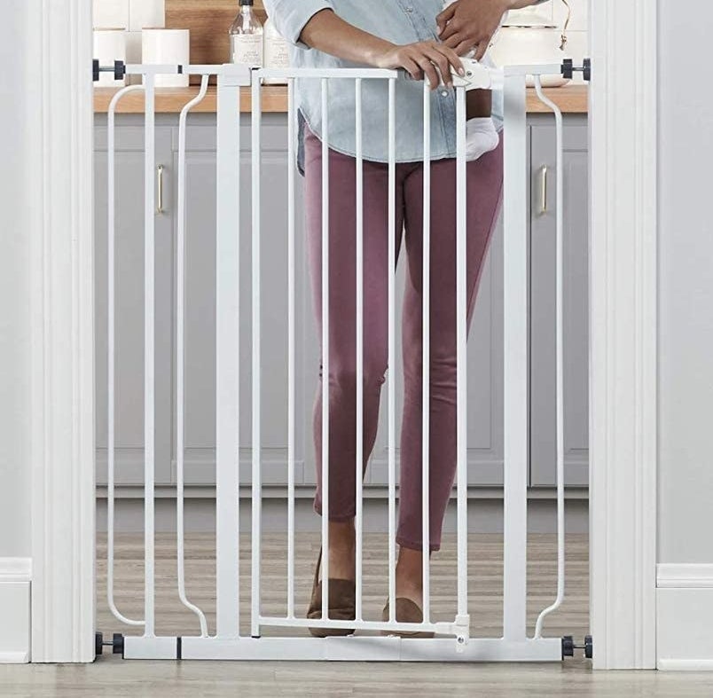a person in front of a baby gate