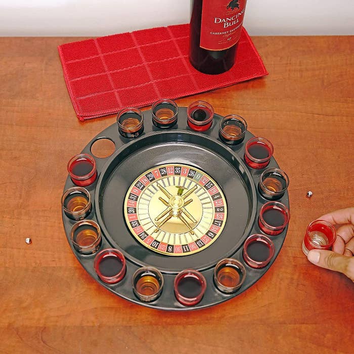 the roulette wheel with full shots in the holders