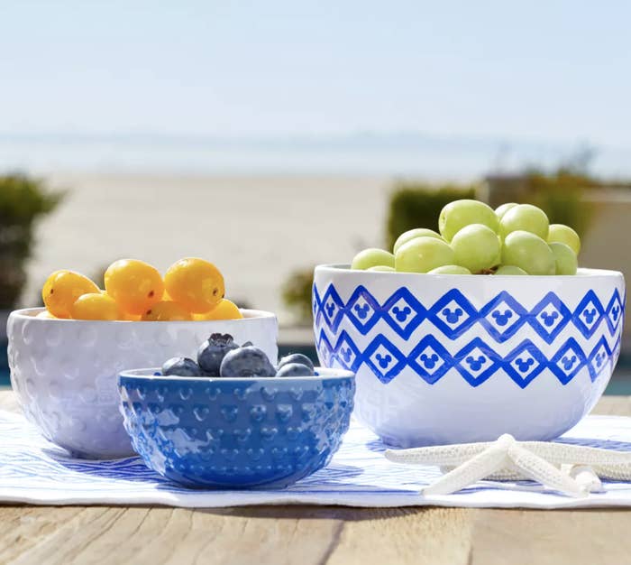 three bowls with filled with fruit with Mickey Mouse details around the bowls