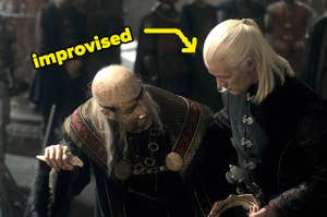 Daemon helping Viserys to the throne in episode 8 of House of the Dragon with text that says "improvised"