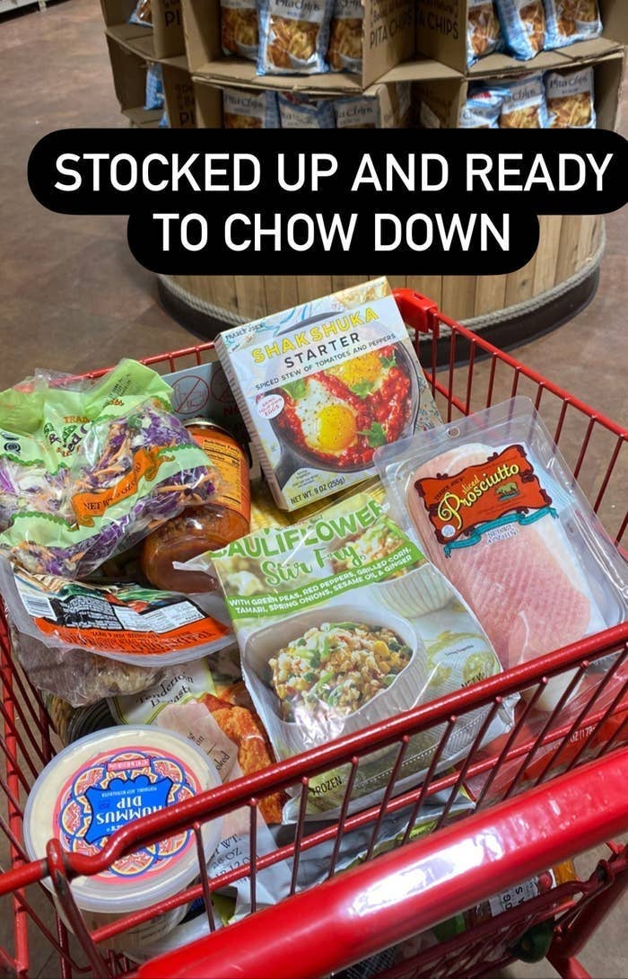 A Trader Joe&#x27;s cart full of groceries.