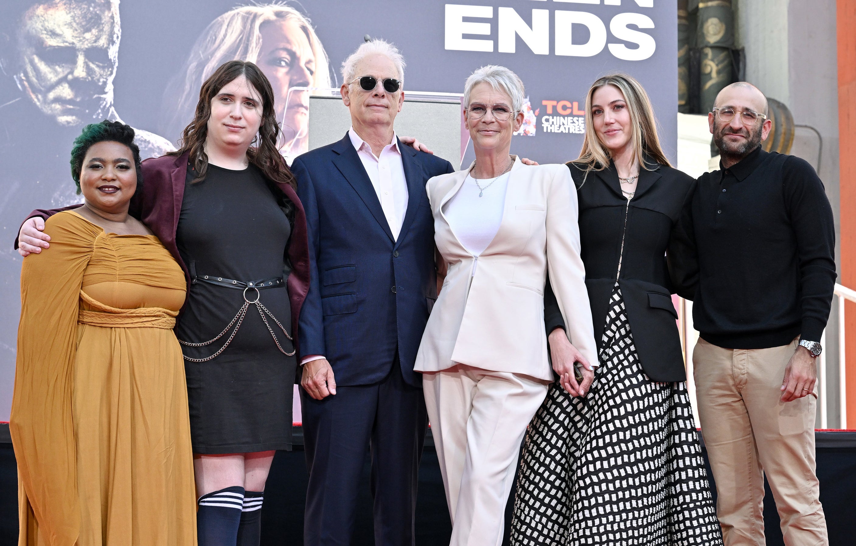 Jamie poses with her husband Christopher Guest, Ruby, her wife, and Annie