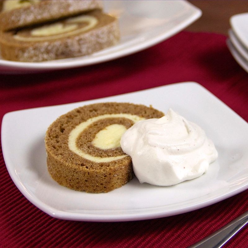 A plop of yummy pumpkin pie whipped cream on a festive fall pastry