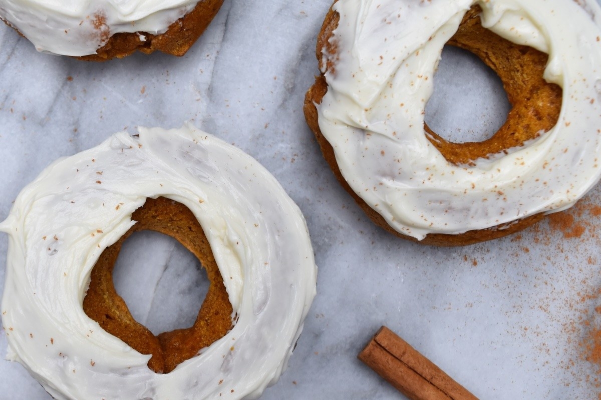 Homemade pumpkin donuts with cream cheese frosting