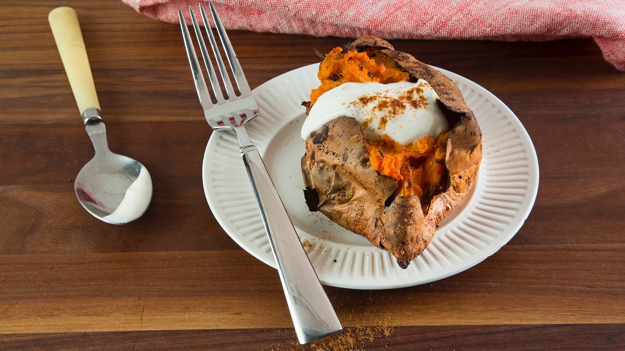 A baked sweet potato on a plate