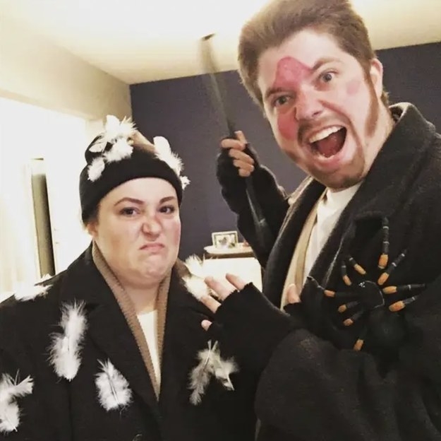 Two people dressed as the Wet Bandits from &quot;Home Alone,&quot; with a fake spider, pillow feathers, and an iron-to-the-face mark on their bodies
