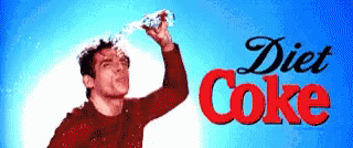 Zoolander pouring water on his head and shaking it off next to a Diet Coke logo