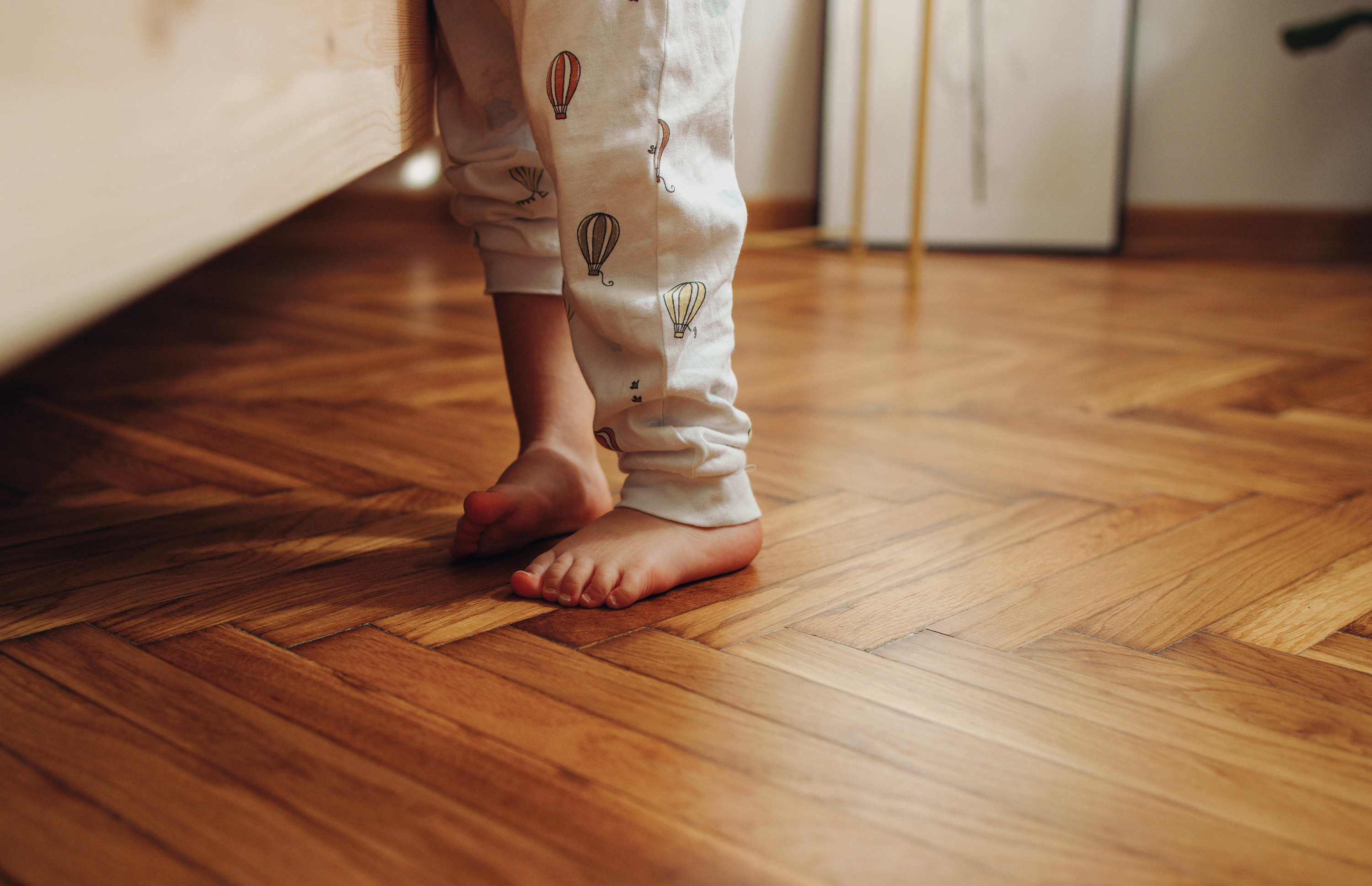 child&#x27;s feet and pajamas
