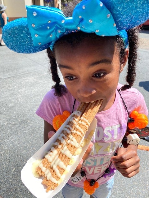 author&#x27;s daughter taking a bite