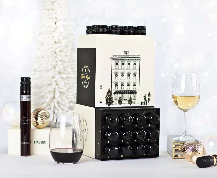the vinebox advent calendar with 12 vials of wine in it