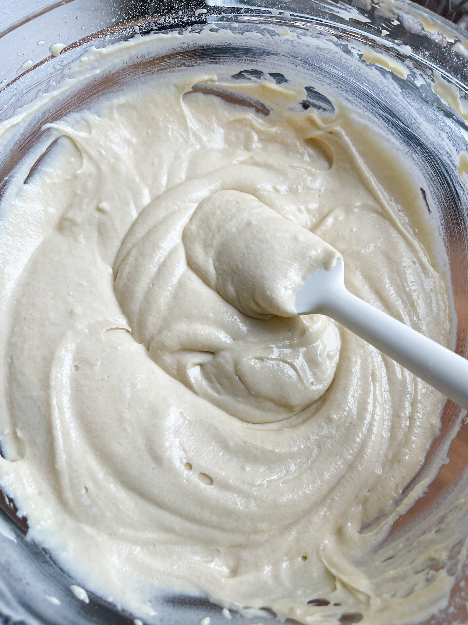 spatula in the center of a bowl of cake batter