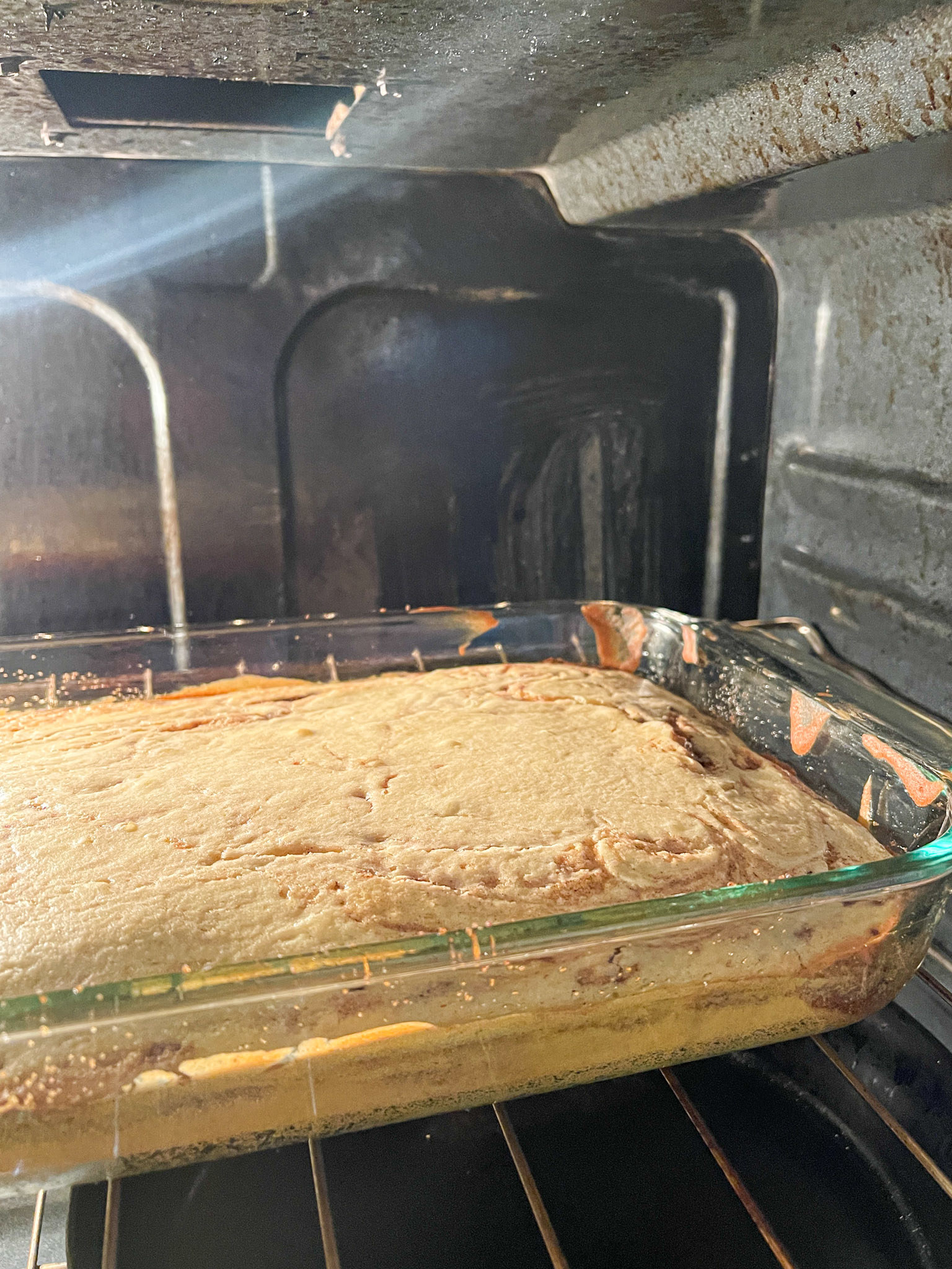cake puffed and baking in the oven