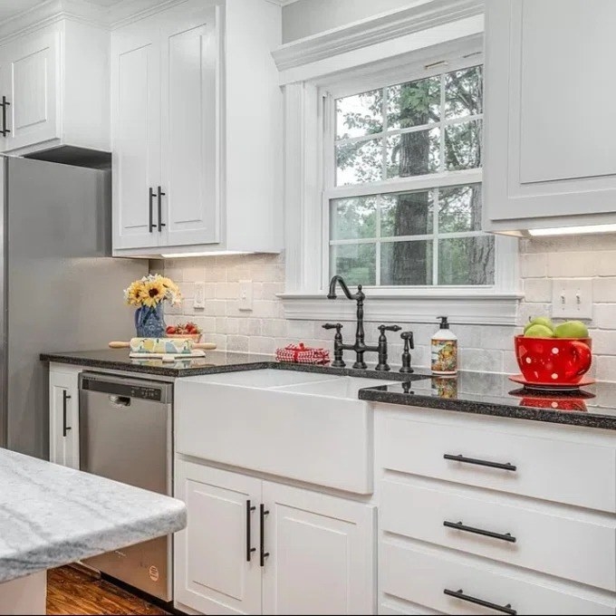 a reviewer photo of the black pulls in a remodeled kitchen