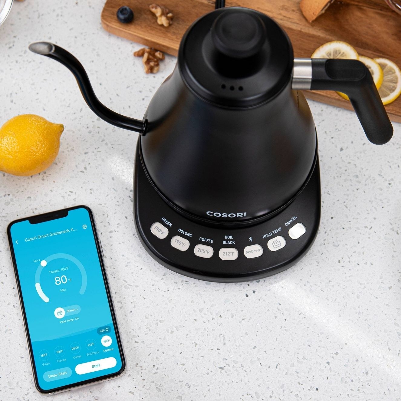 The kettle with a Smartphone app open next to it