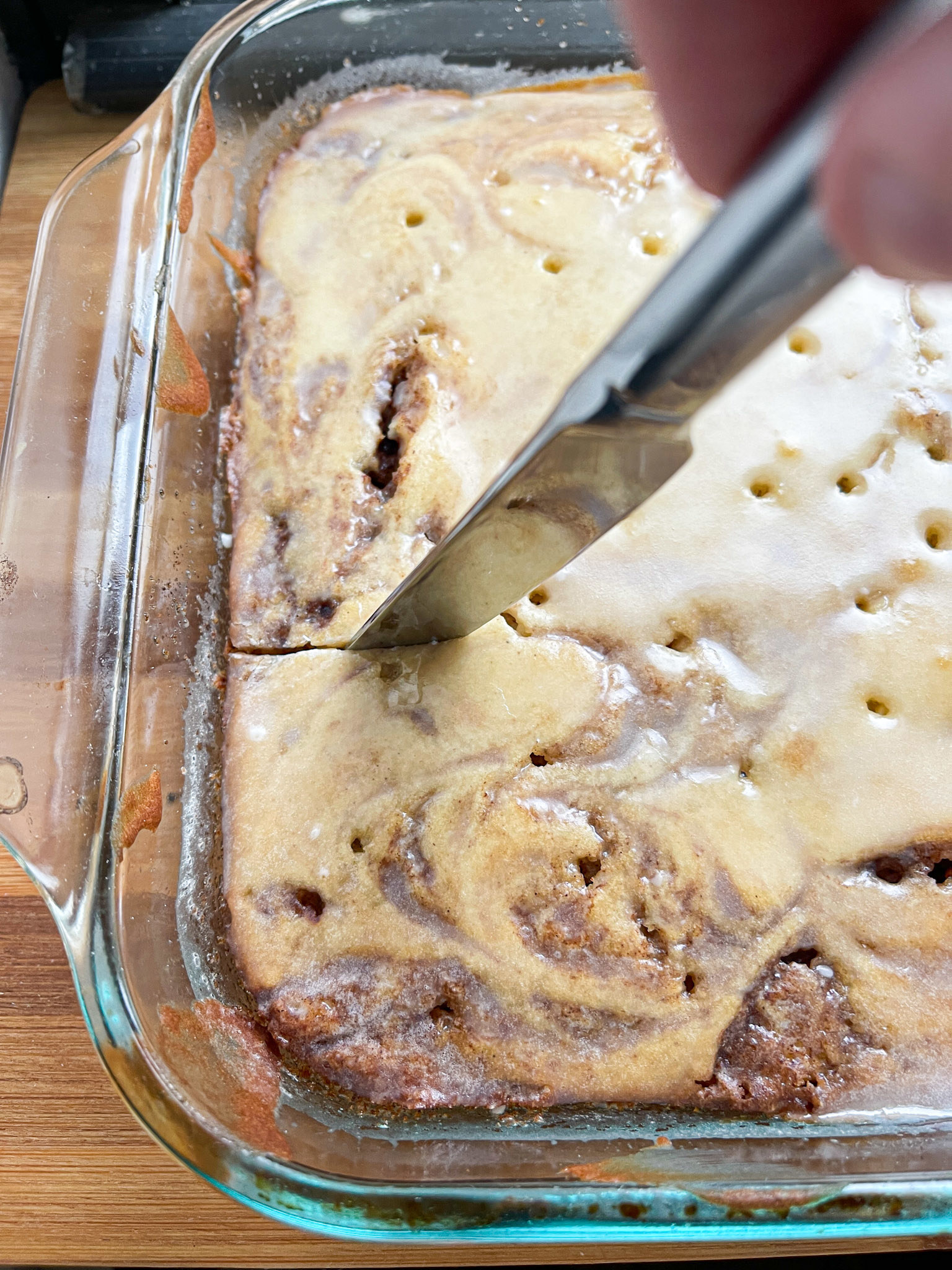 cutting into the finished cake with a knife