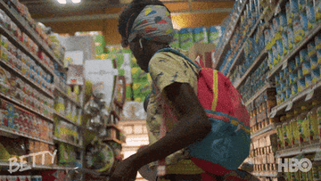 woman dancing in a supermarket aisle