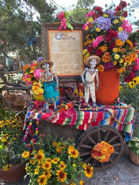day of the dead dolls at an altar