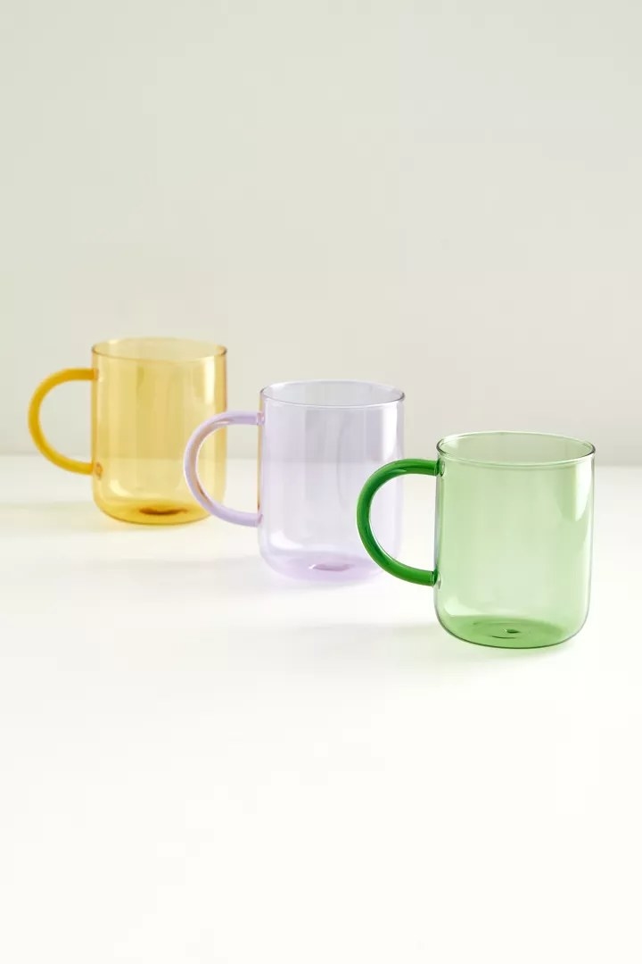 The mugs in the colors Yellow, Purple, and Green