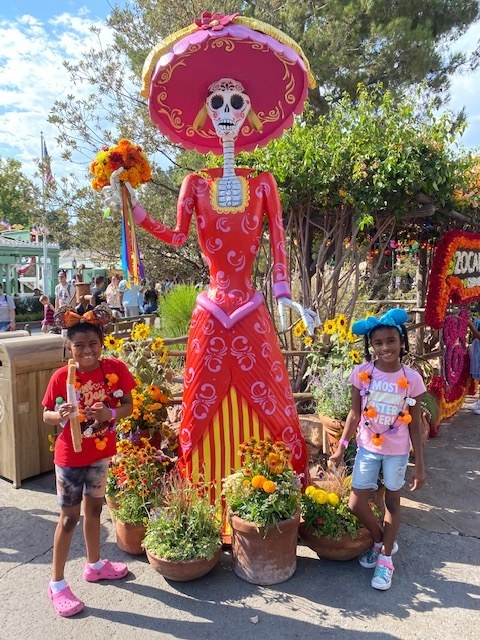 the author&#x27;s daughters in front of the display