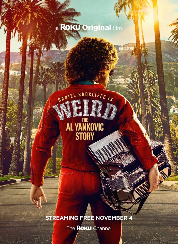 A promo poster for the film that shows Daniel Radcliffe as Al Yankovic from behind standing in the middle of a road with palm trees on either side and holding an accordion