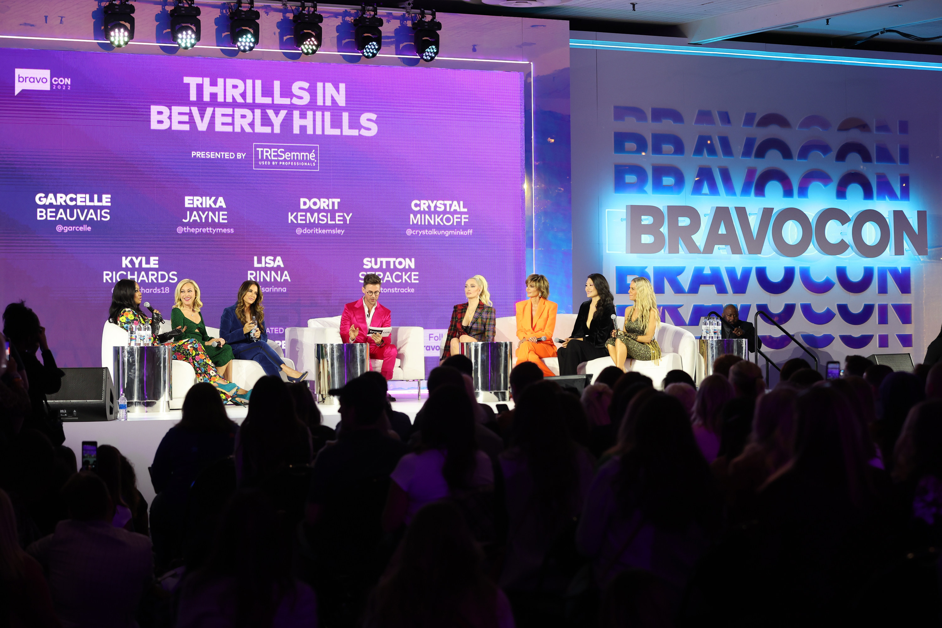 the cast on a panel at Bravocon