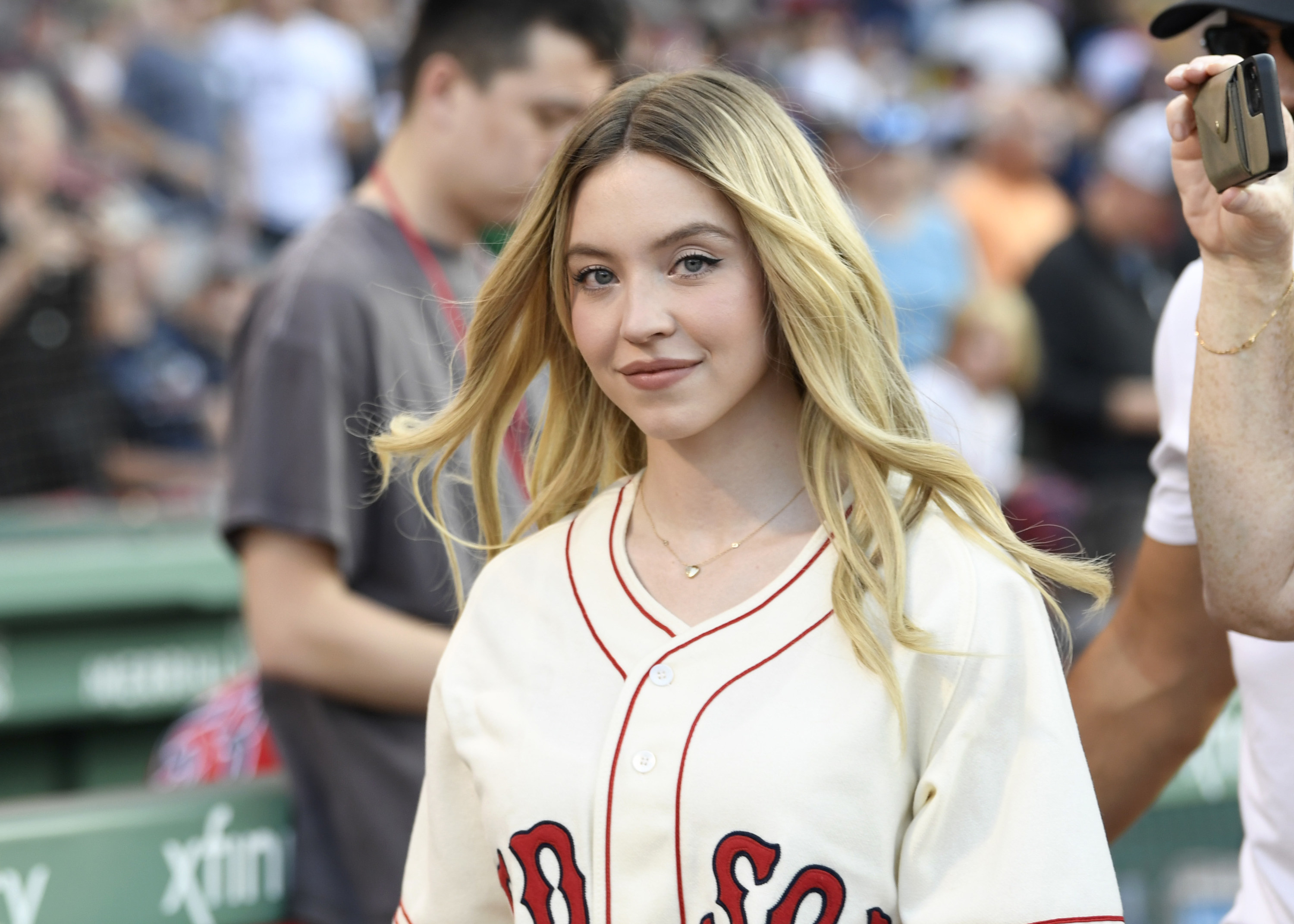 closeup of Sydney wearing a Red Sox jersey