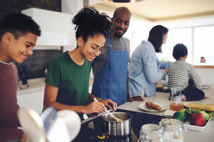 people cooking in a large kitchen