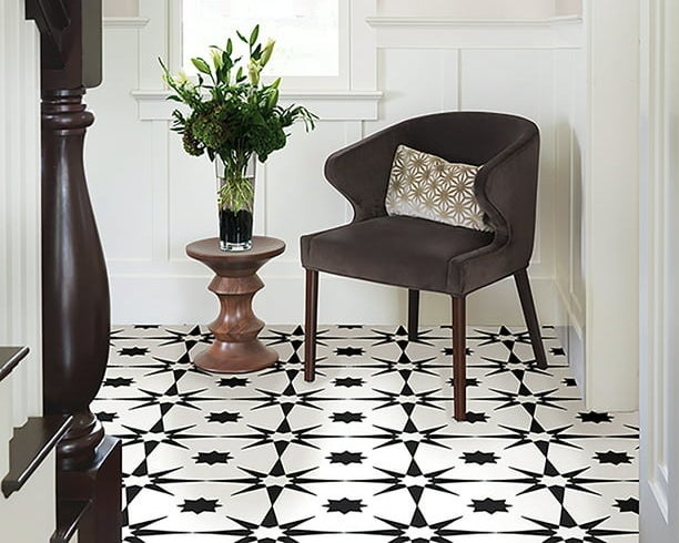 the black and white floor tile in an entryway