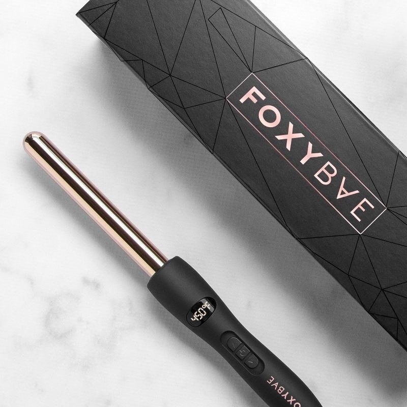A rose gold heat-styling tool