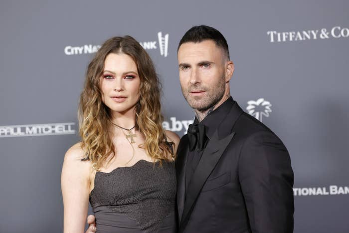 behati and adam at an event