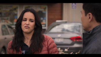 The character played by Melissa Fumero talking to someone