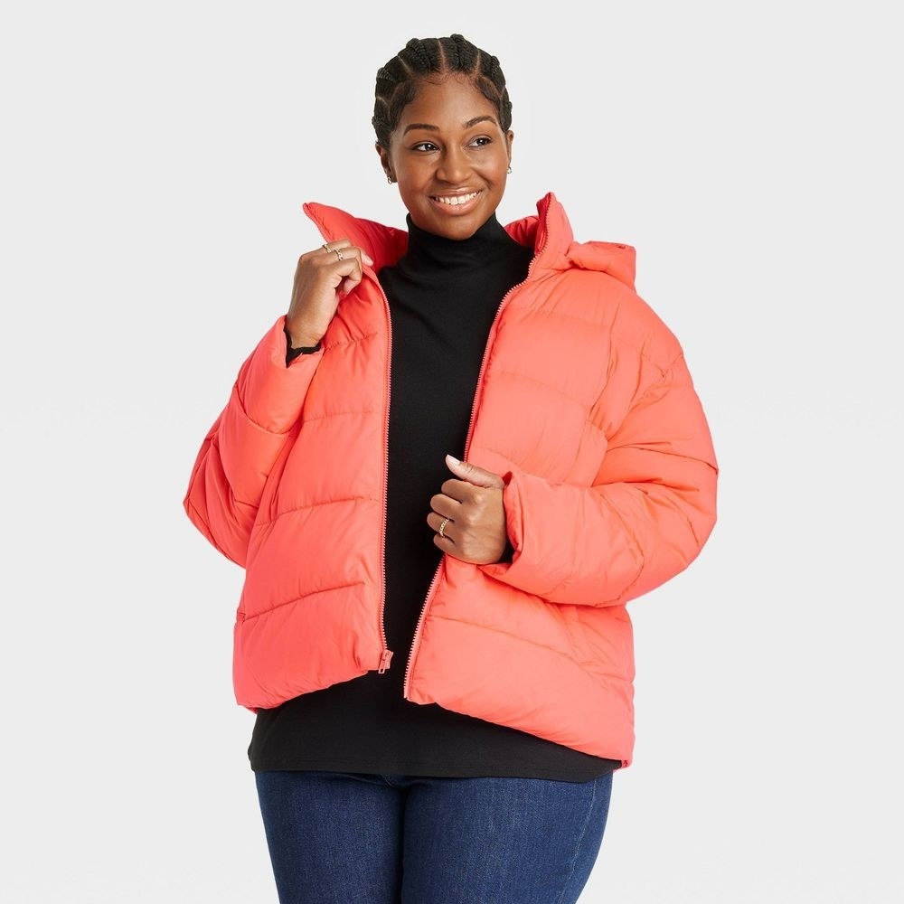 model wearing the puffer coat in pink