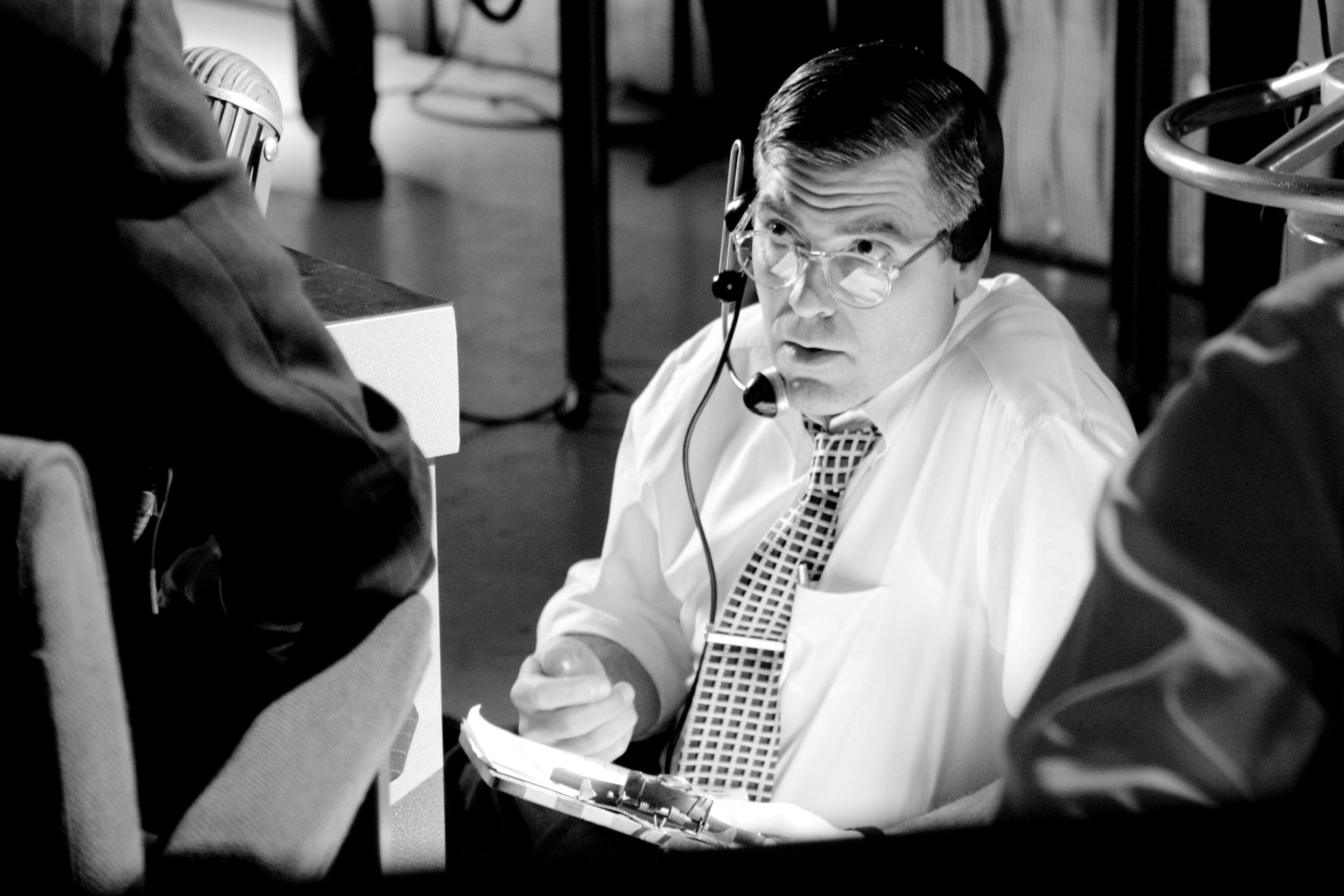 Clooney as TV executive Fred Friendly in the movie wearing an earpiece